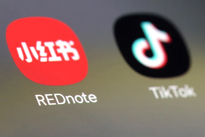 Xiaohongshu (REDNOTE) and TikTok app icons on a mobile screen.